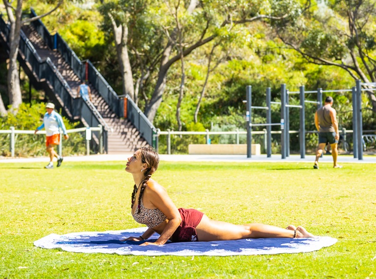Girl doing yoga in the park