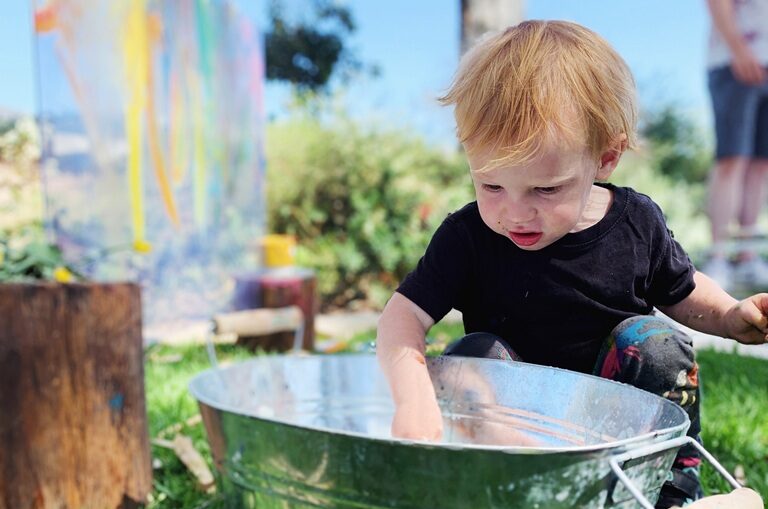 Messy Play child on grass