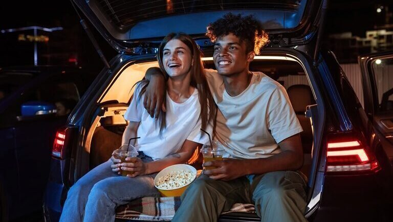 Young couple on date. Outdoor cinema.