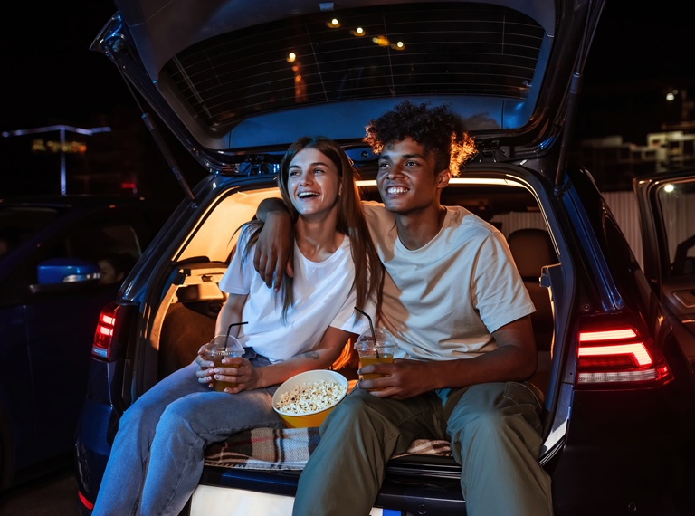 Young couple on date. Outdoor cinema.